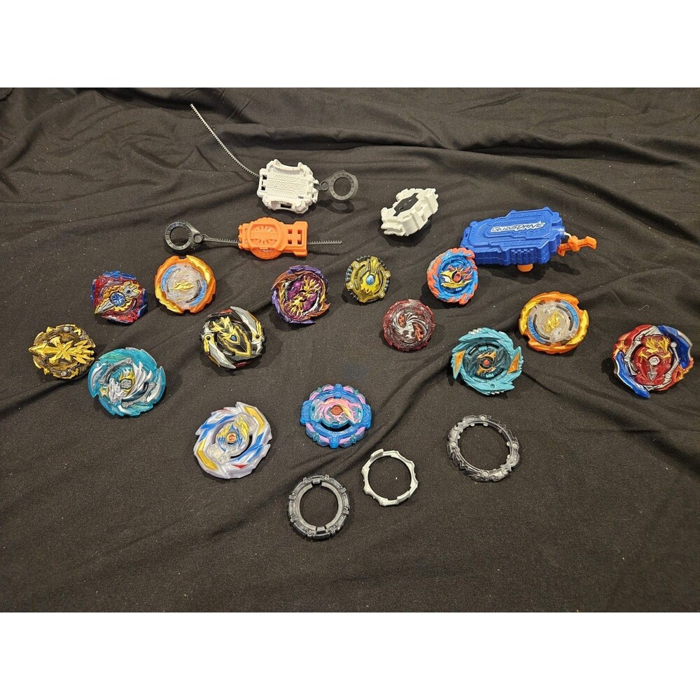 Beyblade Lot Including 12 Tops, 3 Launchers & Extras